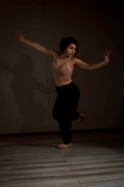 Premium Photo | Slender flexible dance performer during a dance practice in modern studio