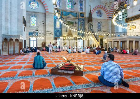 Unidentified Turkish Muslim men praying in Suleymaniye mosque,decorated with Islamic elements ...