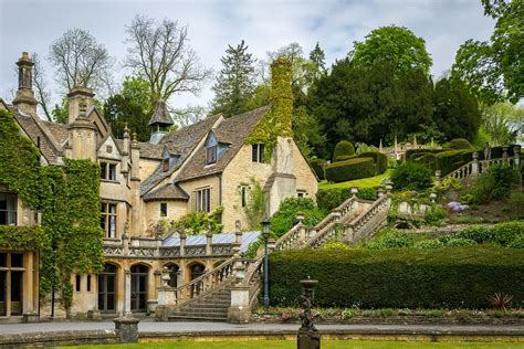 an old house with many windows and steps leading up to the front door ...