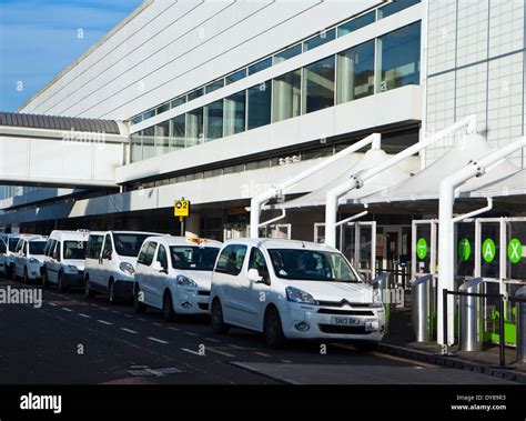 Glasgow airport exterior with taxis Stock Photo - Alamy