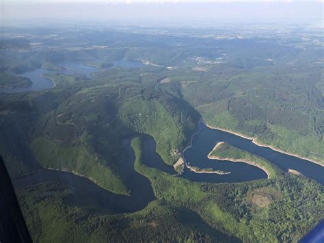 Aerial view of long lake in the green forest free image download