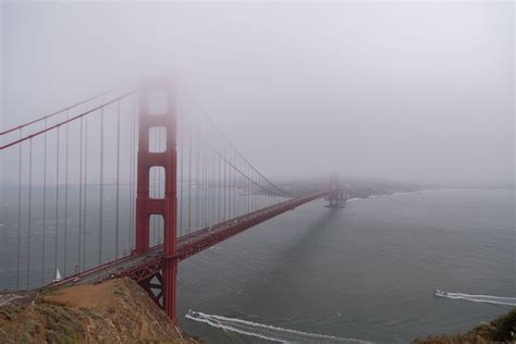 fog rolls in over the iconic golden gate bridge, fog in san francisco 4k HD Wallpaper