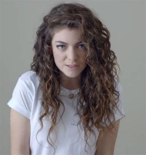 Lorde wore her hair in tight curls parted to the side on her “Royals ...