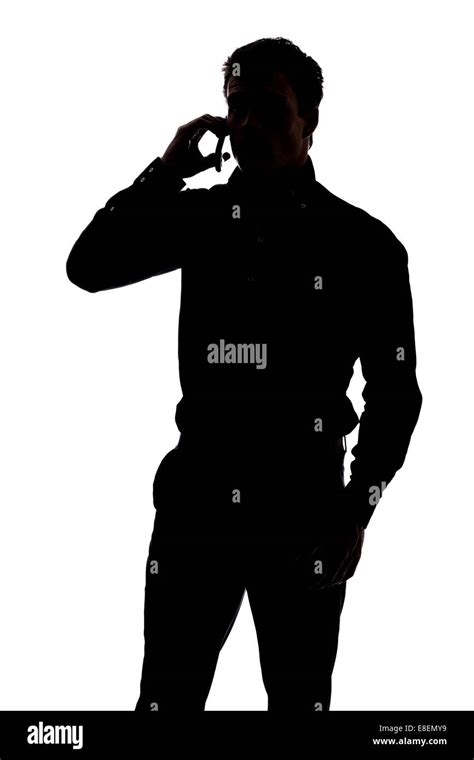 Man talking on cell phone in silhouette isolated over white background Stock Photo - Alamy