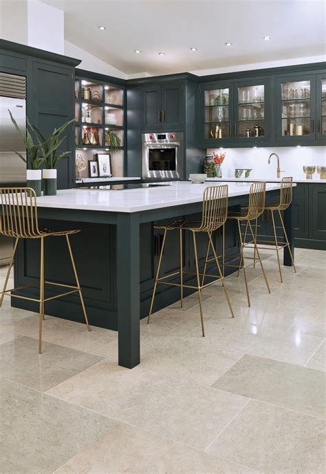Why not match your cabinets to your kitchen island for some serious grown-up glamour? This dark ...