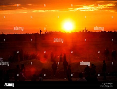 Palestinians seen under sunset during clashes following the "Great March of Return ...