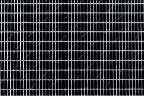 Premium Photo | Steel grating for dark background and texture