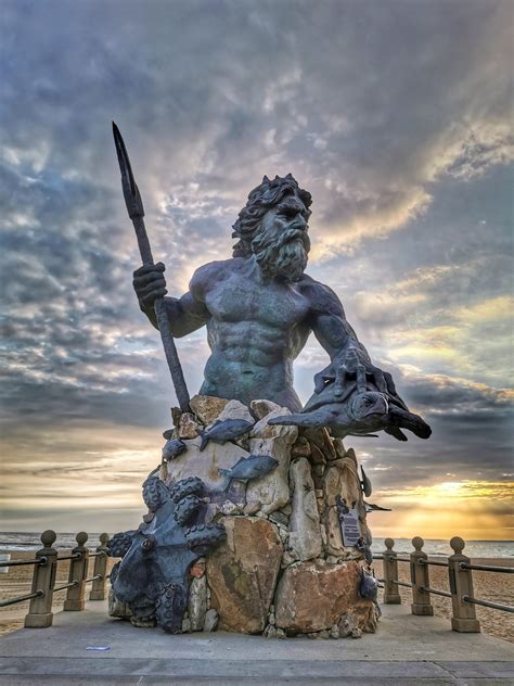 King Neptune statue on Virginia Beach at sunrise - Goat Roti Chronicles