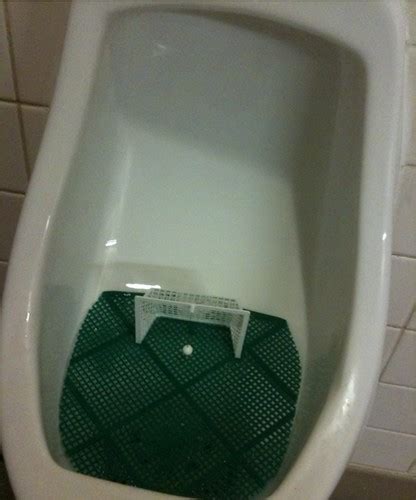 Coolest urinal thing ever: soccer goal with a ball on a st… | Flickr