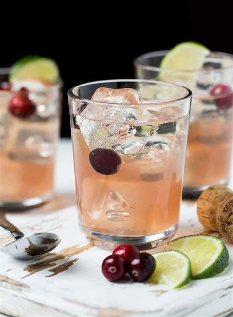 Sparkling Cranberry Gin Christmas Cocktails - Garnish with Lemon