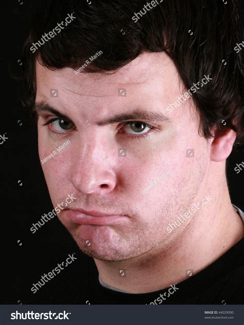 Young Man With A Scowl On His Face Stock Photo 44029090 : Shutterstock