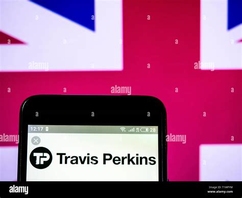 In this photo illustration a Travis Perkins plc logo seen displayed on a smart phone Stock Photo ...