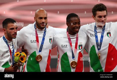 Members of Italy athletes celebrate during an award ceremony of the Men's 4 x 100m Relay Final ...