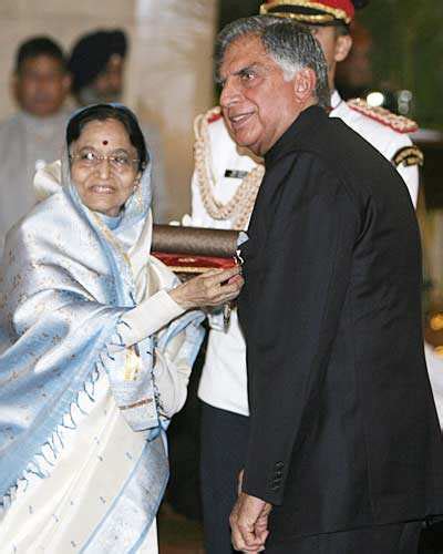 President of India Pratibha Patil (L), presents Padma Vibhushan, one of ...