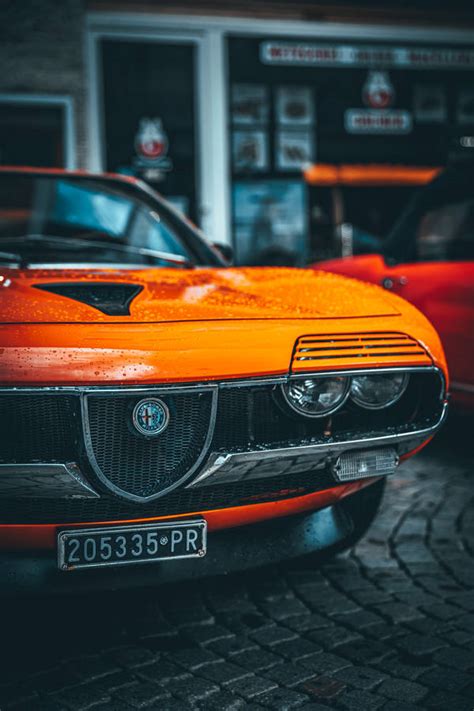 Download Orange Alfa Romeo Montreal Wallpaper | Wallpapers.com