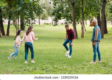 Cheerful Multicultural Group Friends Playing Football Stock Photo 1339259156 | Shutterstock