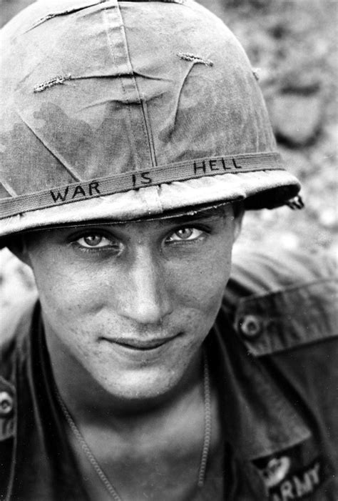 June 1965 — "War Is Hell" An unidentified U.S. Army soldier wears a hand-lettered “War Is Hell ...