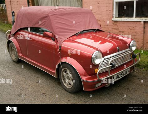 Red mini Cabriolet open top car with cover Stock Photo - Alamy