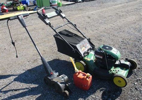 John Deere 22" lawn mower with bagger, runs, deck is getting rusty; Gas can; Craftsman electric ...