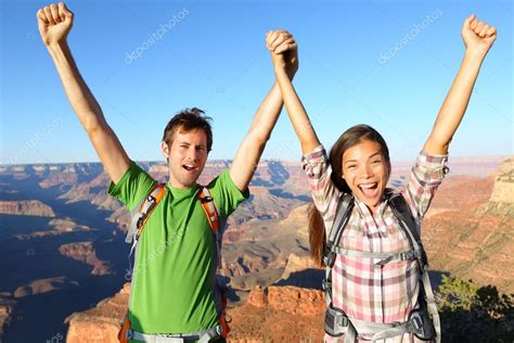 Happy people celebrating cheering in Grand Canyon — Stock Photo © Maridav #41034111