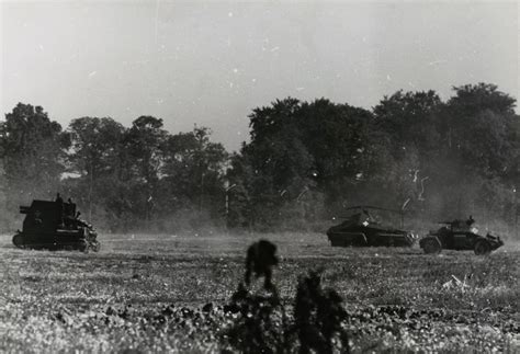 Sturmpanzer I on the move in France along with a Schwerer ...