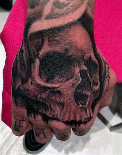 Skull Hand Tattoos