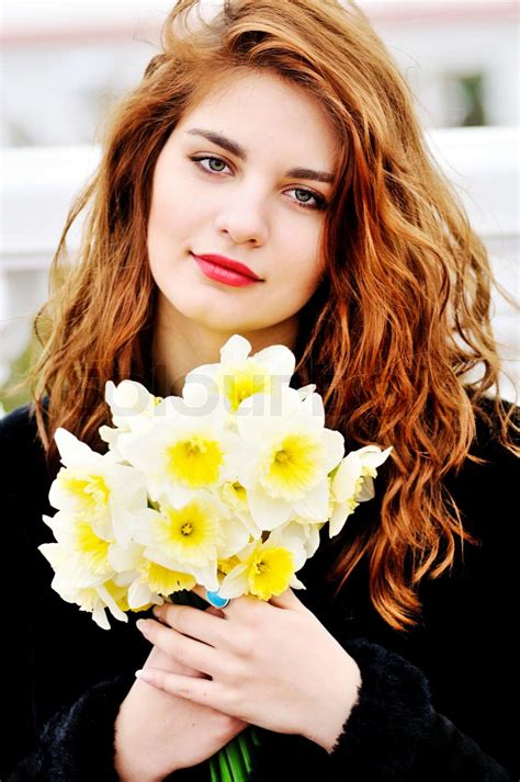 girl with daffodils | Stock image | Colourbox