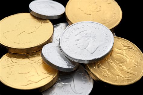 Photo of Chocolate coins wrapped in golden and silver paper | Free christmas images