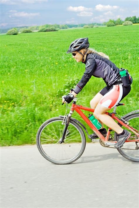 Young Woman Riding a Mountain Bike Stock Photo - Image of concept ...