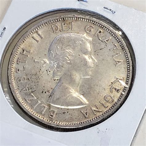 1958 CANADIAN SILVER DOLLAR - Big Valley Auction