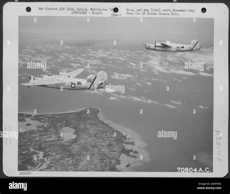 Consolidated B-24 "Liberators" of the 494th Bomb Group, approach the target near Cebu City, Cebu ...