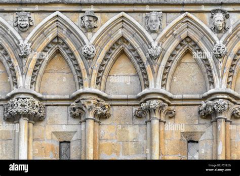 Decorated gothic stone arches on the west wall at the medieval ...