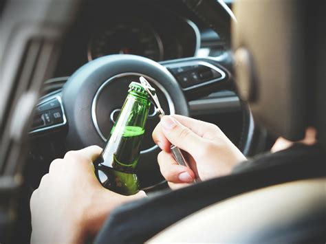 Person Opening Bottle on Car · Free Stock Photo