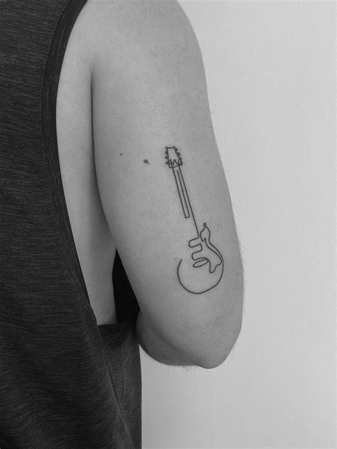 Minimal Guitar Tattoo | Guitar tattoo, Music tattoo designs, Small ...