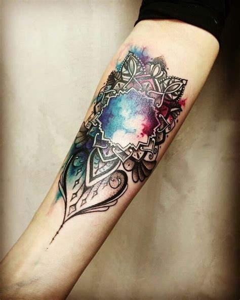 a colorful watercolor tattoo on the arm