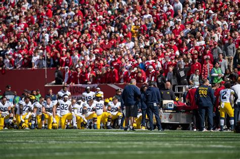 Michigan football coach Mike Hart suffers seizure, carted off field