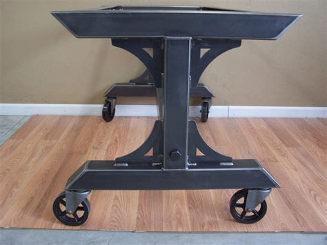 Industrial steel rolling table base on heavy duty vintage style casters. This base is suitable ...