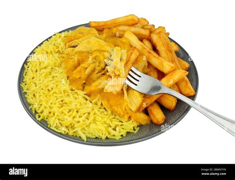 Chicken curry meal with half rice and chips isolated on a white ...