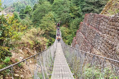 Hanging bridge in Nepal Himalaya near Lukla, Photograph by Marek Poplawski