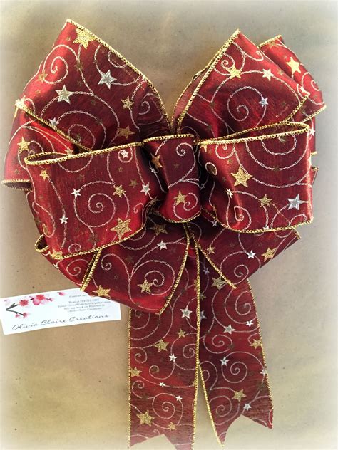 Sheer Christmas Bow. 2.5 inch wired ribbon in a Wine color with gold and silver embroidery. Apx ...