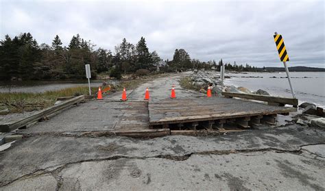 Photos of post-tropical storm Lee damage to Green Bay Road and Rissers Beach Provincial Park in ...