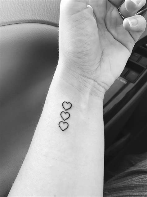 Finally got my tattoo. Three hearts to represent my kids! | Wrist tattoos girls, Tattoos for ...