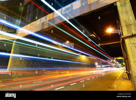 light trails in city at night Stock Photo - Alamy