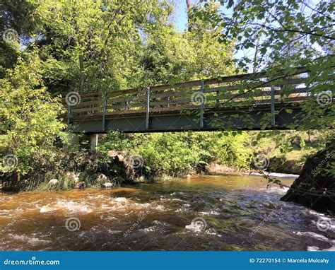 Bridge over a creek stock photo. Image of brown, creek - 72270154