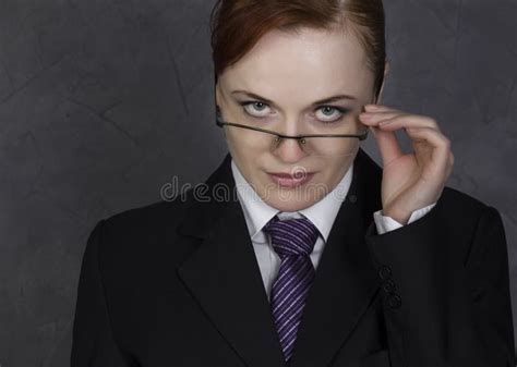 Female Lawyer Holding a Big Book with Serious Expression, Woman in a Man`s Suit, Tie and Glasses ...