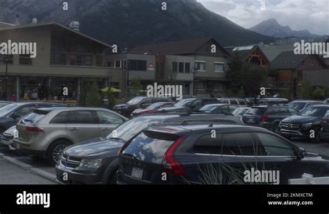 Full parking lot in downtown Banff with mountains in Banff Stock Video Footage - Alamy