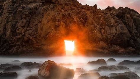 Big Sur's fiery keyhole arch alit for a limited time