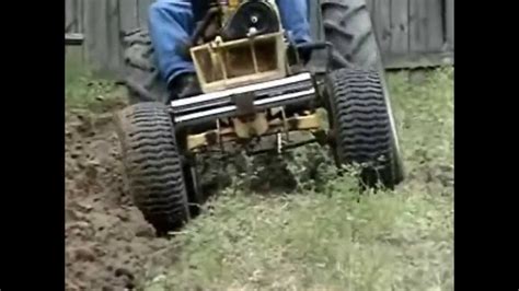 ST16 Sears Tractor Plowing a Garden - YouTube