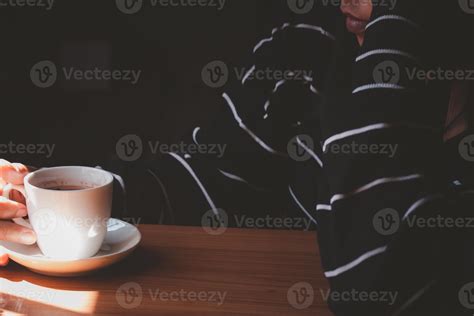 People picking up white coffee mugs. Vintage style photo. 21162928 Stock Photo at Vecteezy