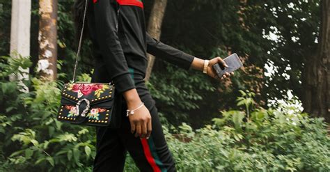 Woman Wearing Black Gucci Tracksuit · Free Stock Photo